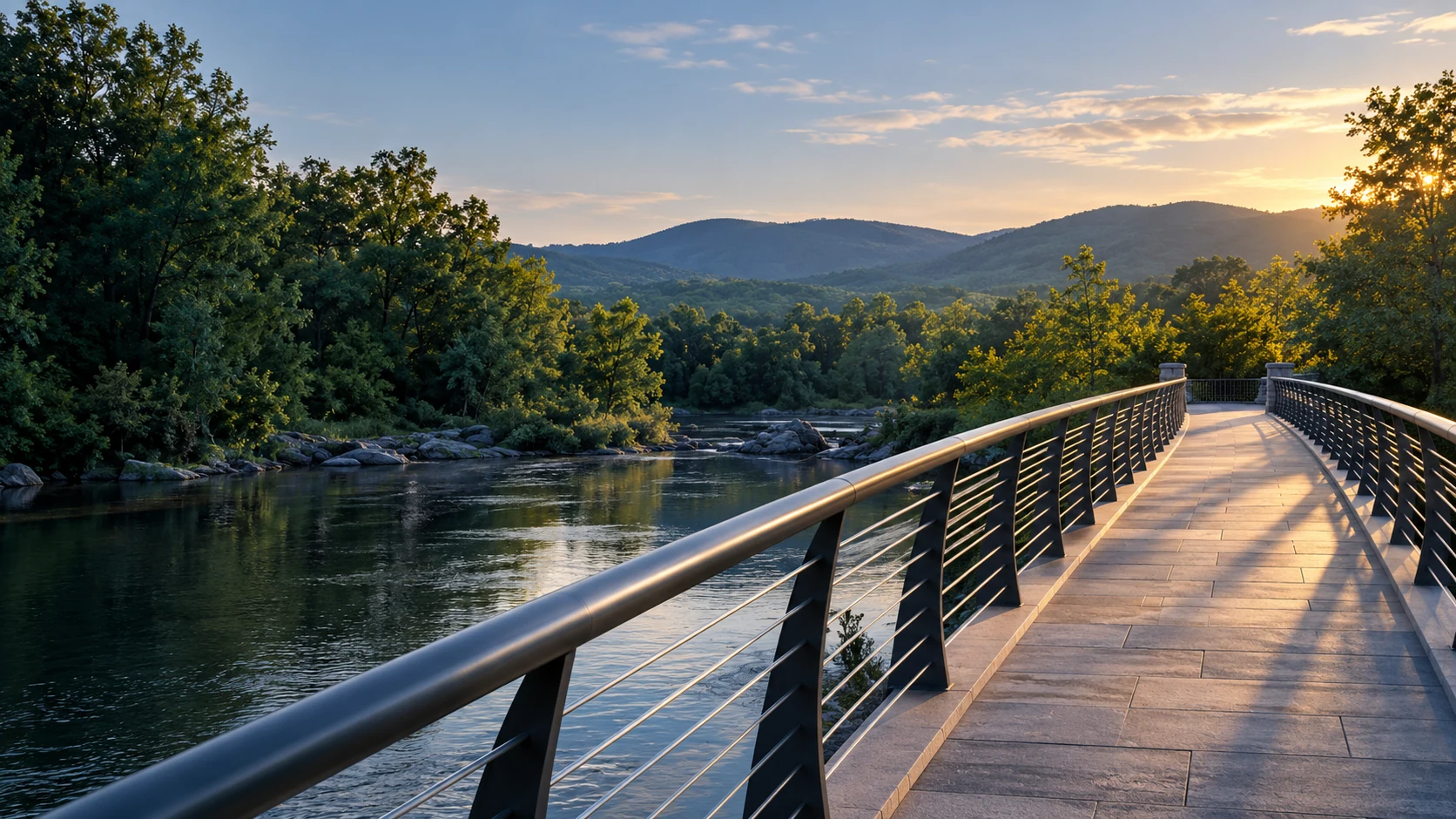 A pedestrian bridge crossing calm water toward a wooded riverbank.